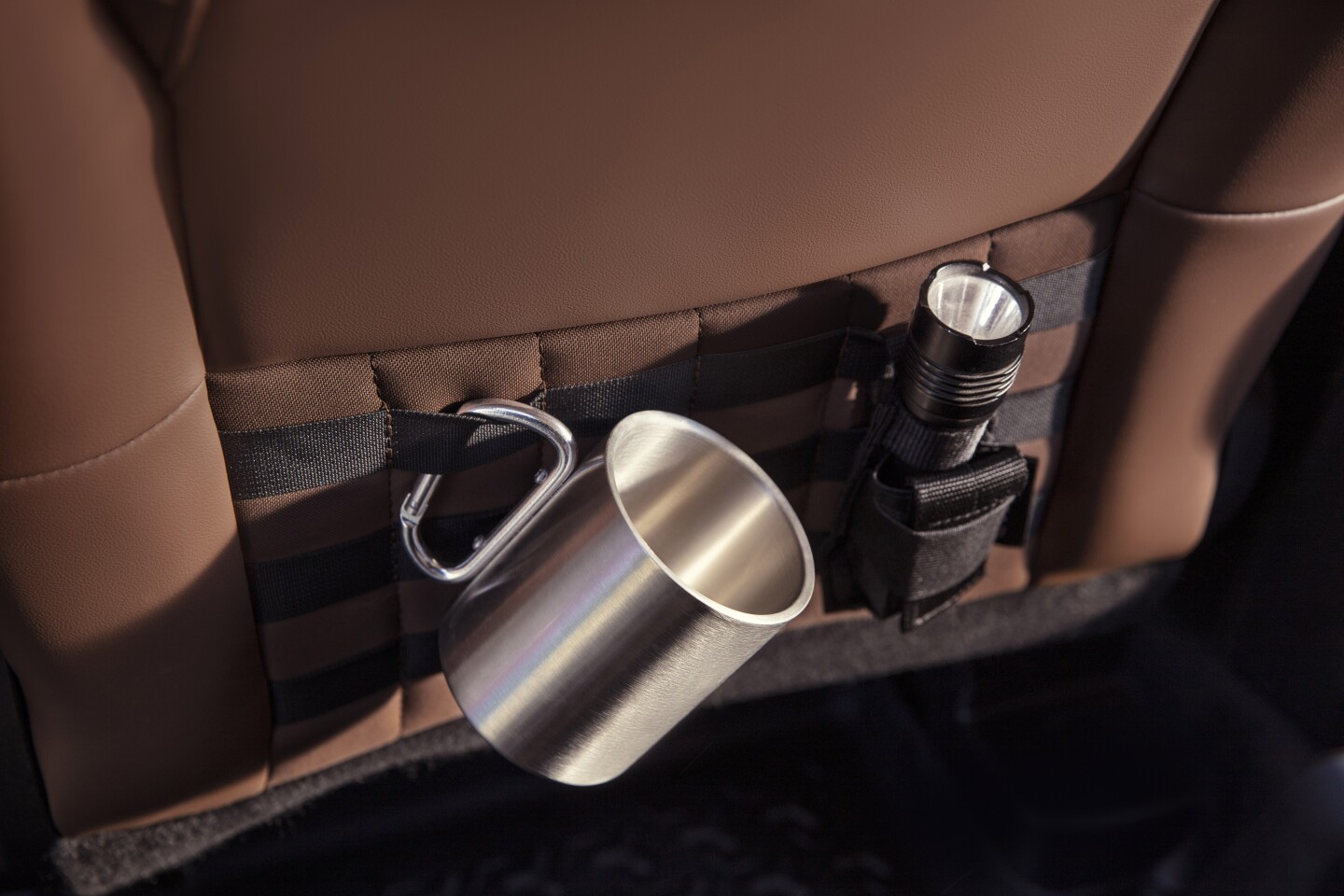 Human-centered design led to special Bronco Sport features, such as seatback MOLLE strap system to help users safely and easily transport gear. (Pre-production model pictured.)
