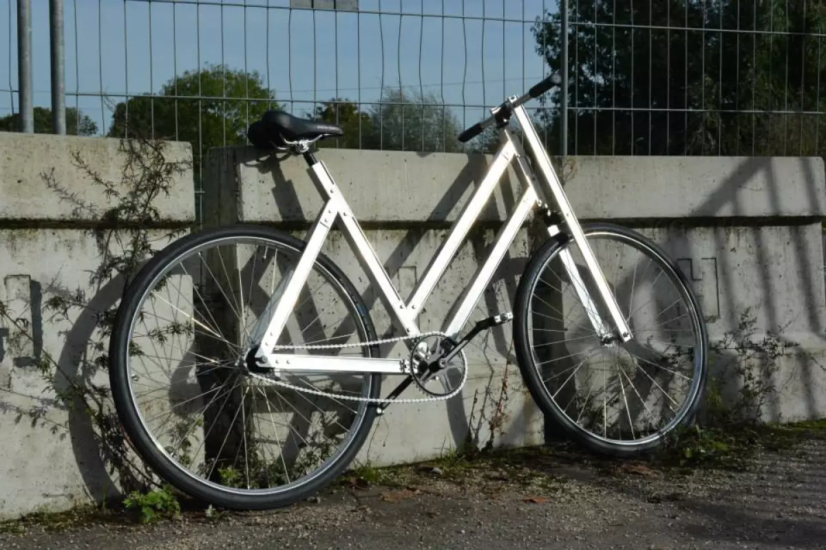 The Reframed bike's frame is made from extruded aluminum, and is bolted together by the buyer