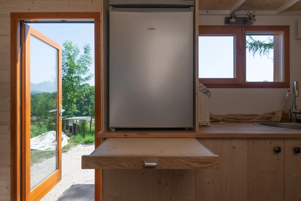 The Tiny House Franck's kitchen includes a pull-out table
