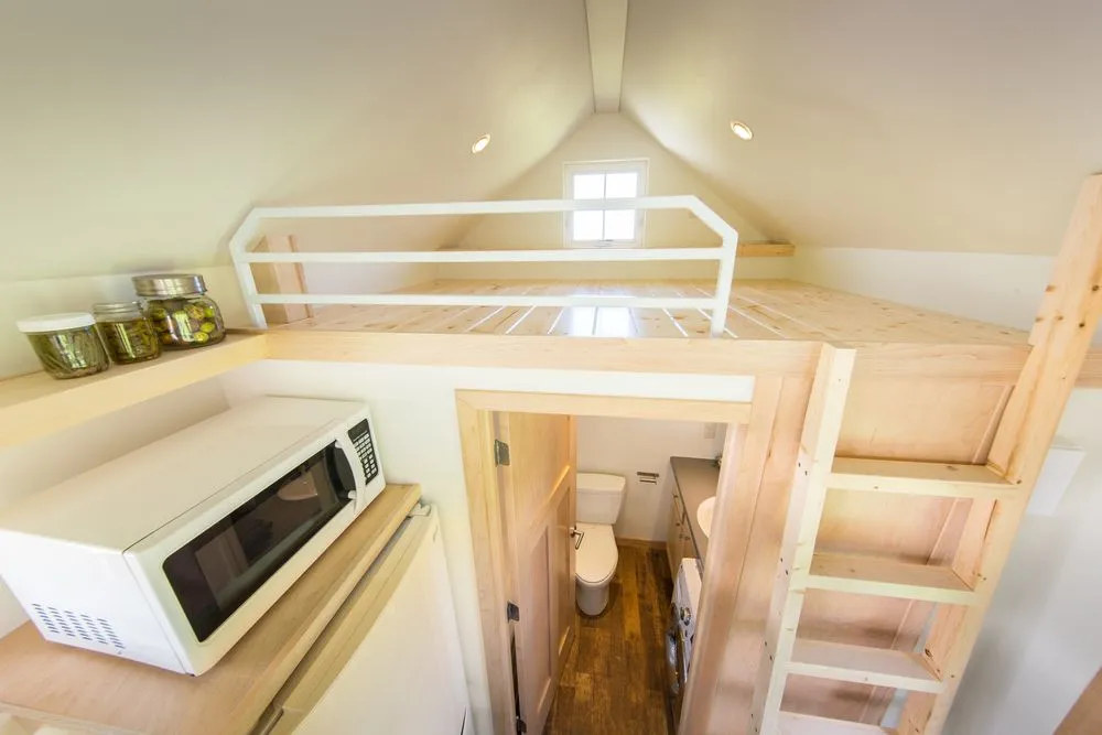 The sole upstairs sleeping loft, though another can be added at cost