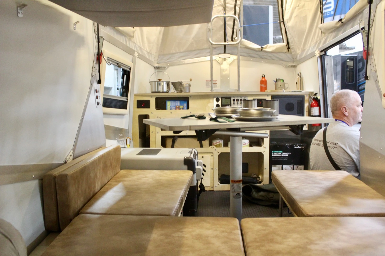 The Taxa Cricket is a 2+2 small family trailer designed to sleep two adults and up to two children; you can see the underside of the suspended single bed up top left