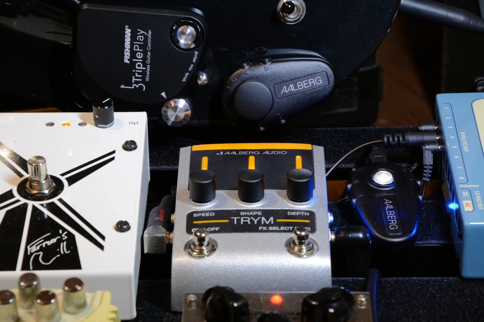 The Trym sat next to the Farmer's Mill on our pedalboard, and the Moon plugged into our old Vox stage amp - both under the control of the Aero attached to our test laboratory guitar