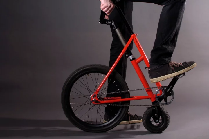 Two wheels, pedals, a saddle and half a frame