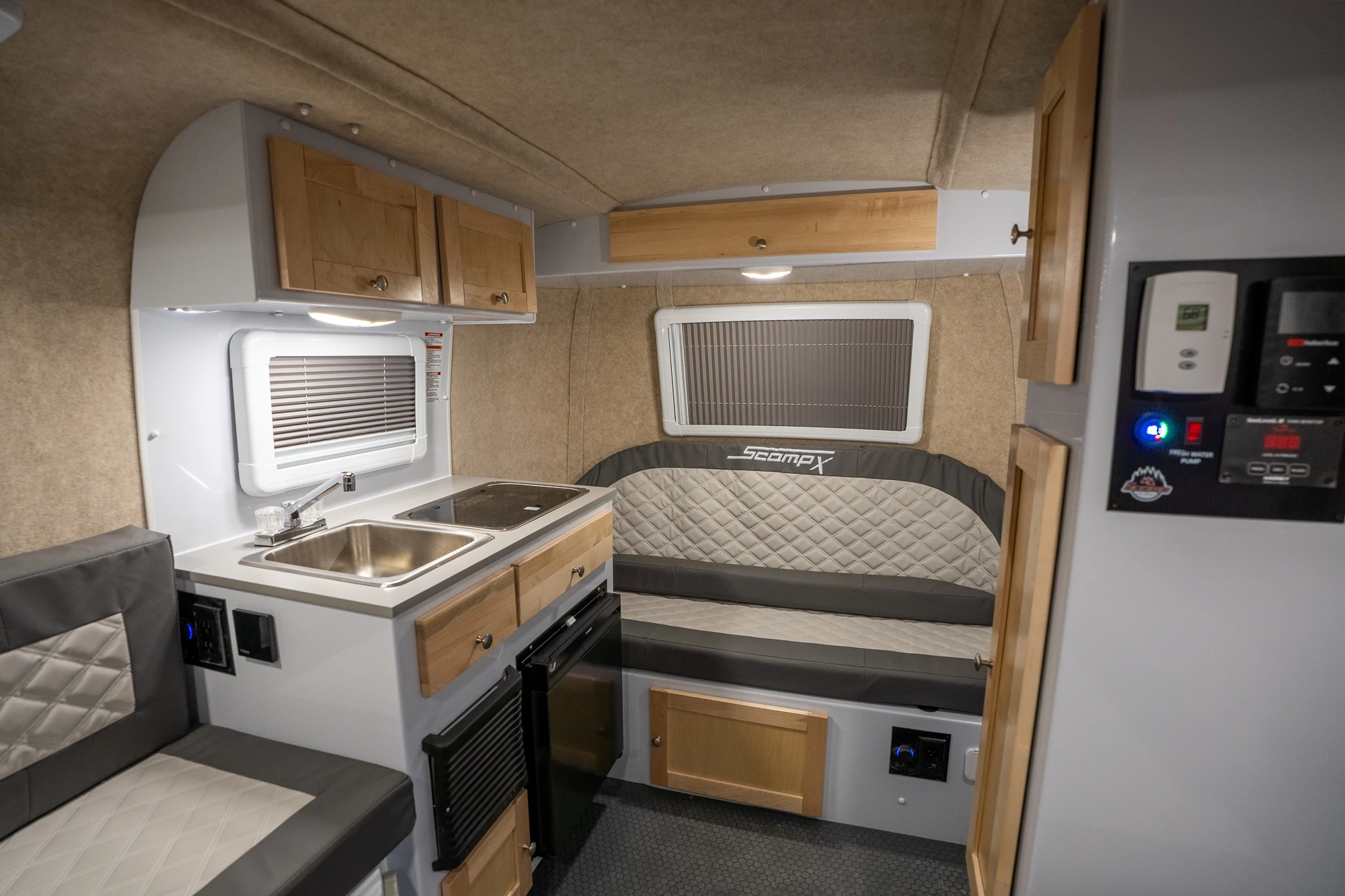 The TRK floor plan includes a front sofa that transforms into a pair of bunkii beds