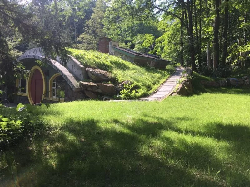 Hobbit Hollow is situated on 1.7 acres (0.68 hectare) of land, near a stream and a waterfall