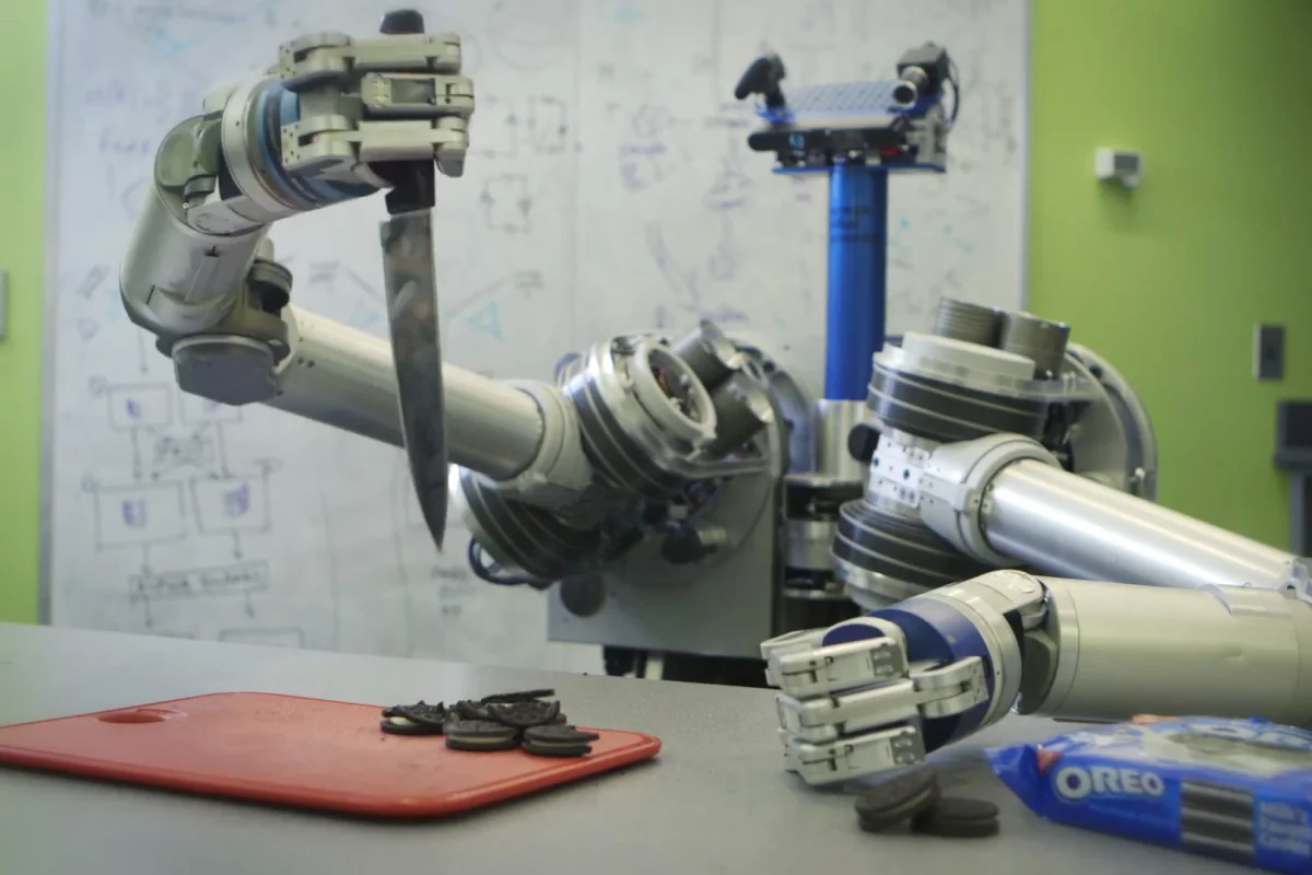 HERB brandishes a knife in a futile attempt to separate cookie from creme