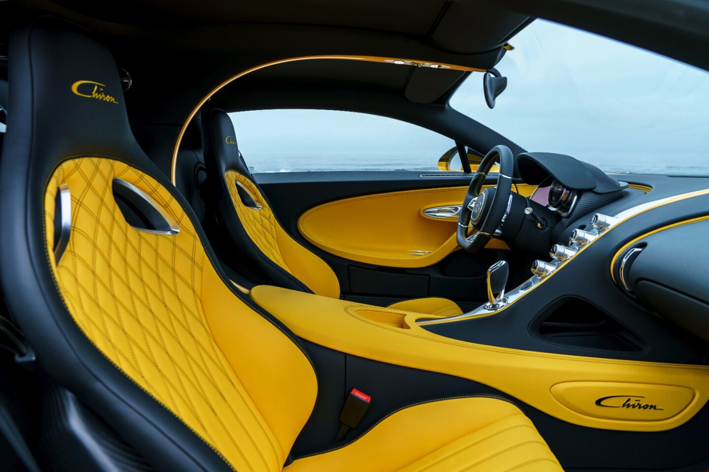 The interior features a yellow-black scheme to match the exterior