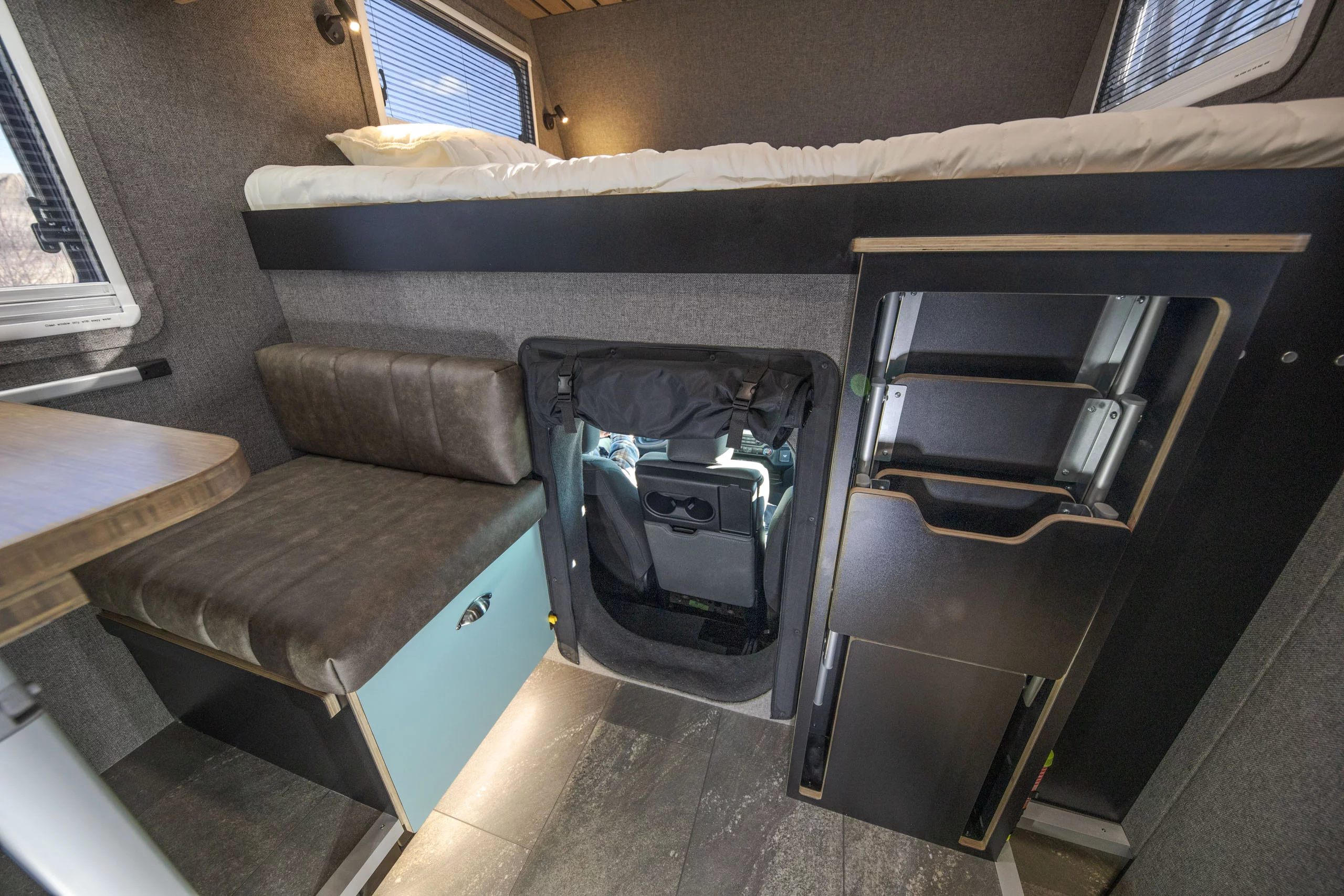 The Grid Mini includes a pass-through between cab and camper