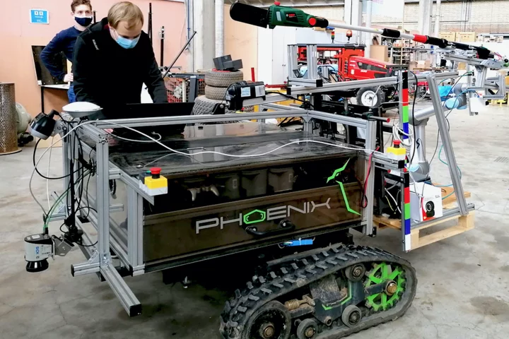 The Phoenix robot, with its arm-mounted sheathed power saw (green) visible at the top of the photo