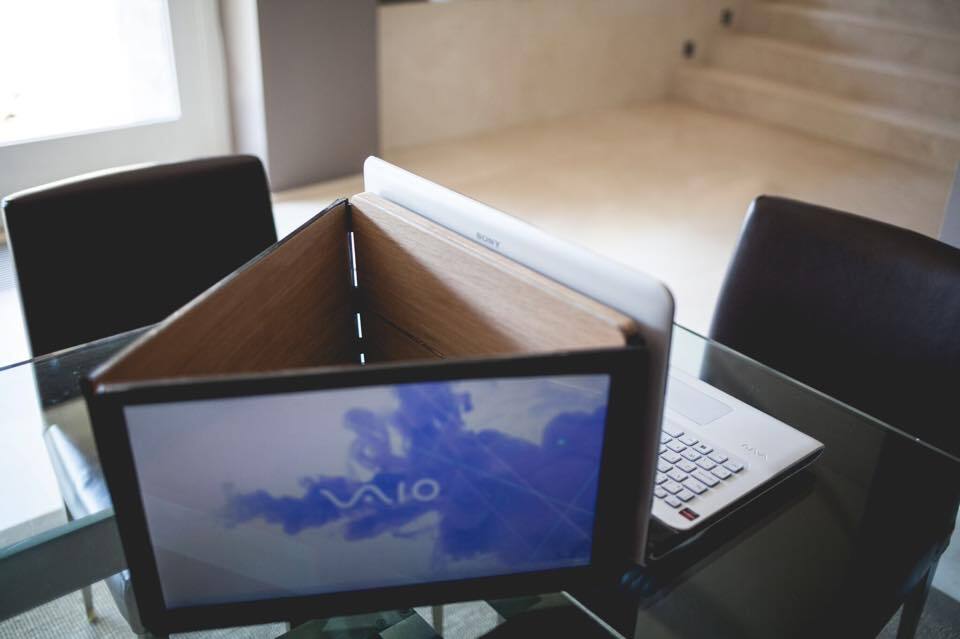 A three-screen configuration in a triangular pattern could replace a projector at meetings