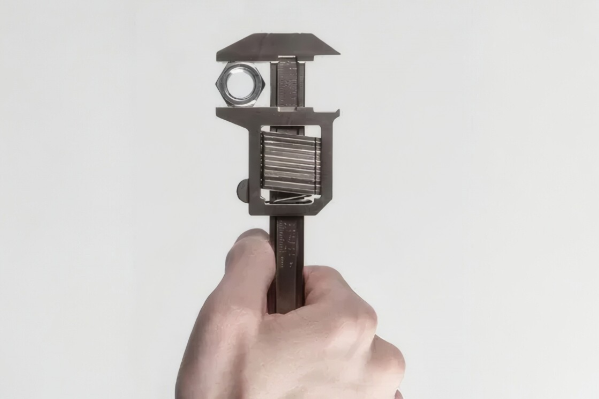 Caliper-style adjustable wrench accommodates every nut size on the fly