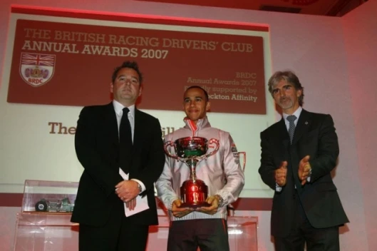 Formula One driver Lewis Hamilton receives the Graham Hill Trophy