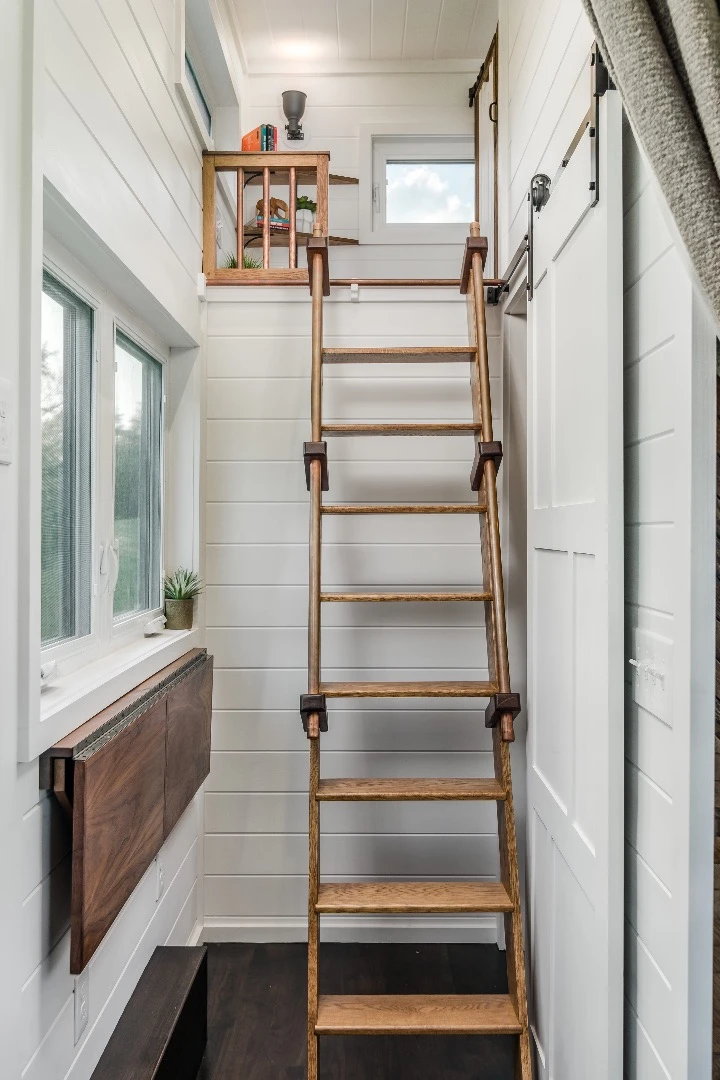 The Escher's small home office includes a ladder which provides access to the second bedroom