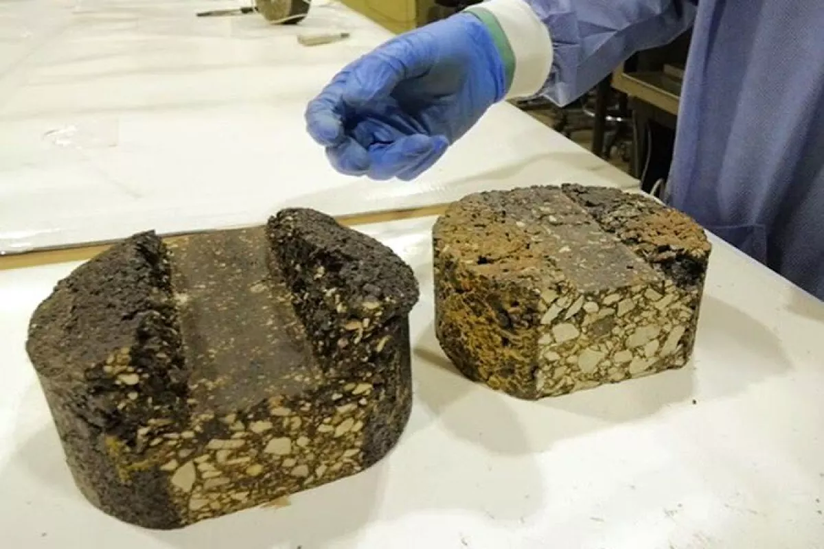 Chunks of asphalt made with binders derived from pig manure, which can replace the petroleum found in traditional asphalt