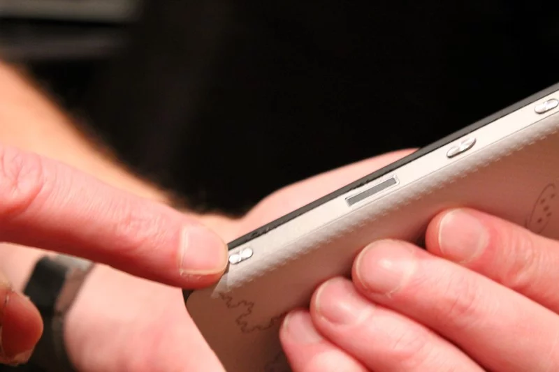 Dedicated camera shutter hard button