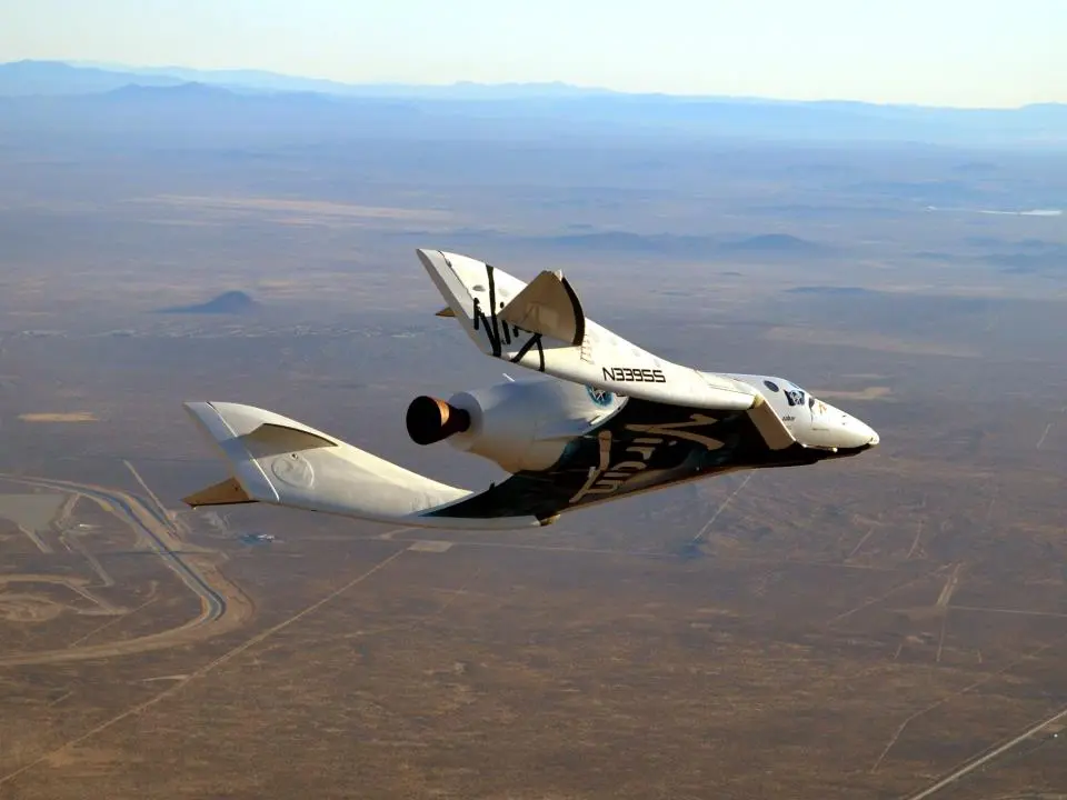 SpaceShipTwo's first glide in powered flight configuration with the rocket motor nozzle visible