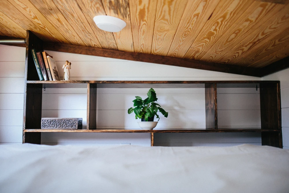 The sleeping loft boasts integrated storage