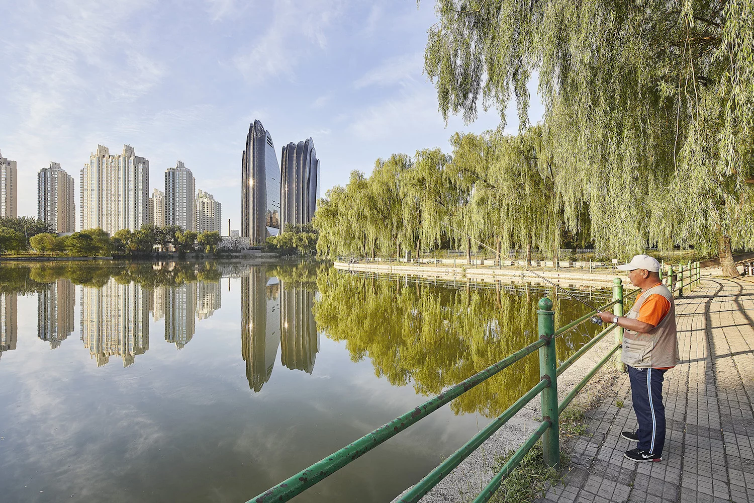 The Chaoyang Park Plaza's twin towers rise to a maximum height of 142 m (465 ft)-tall