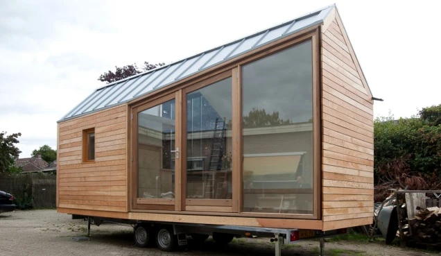 The home also features an elevated double loft bed, kitchen, bathroom with dry toilet and LED lighting throughout
