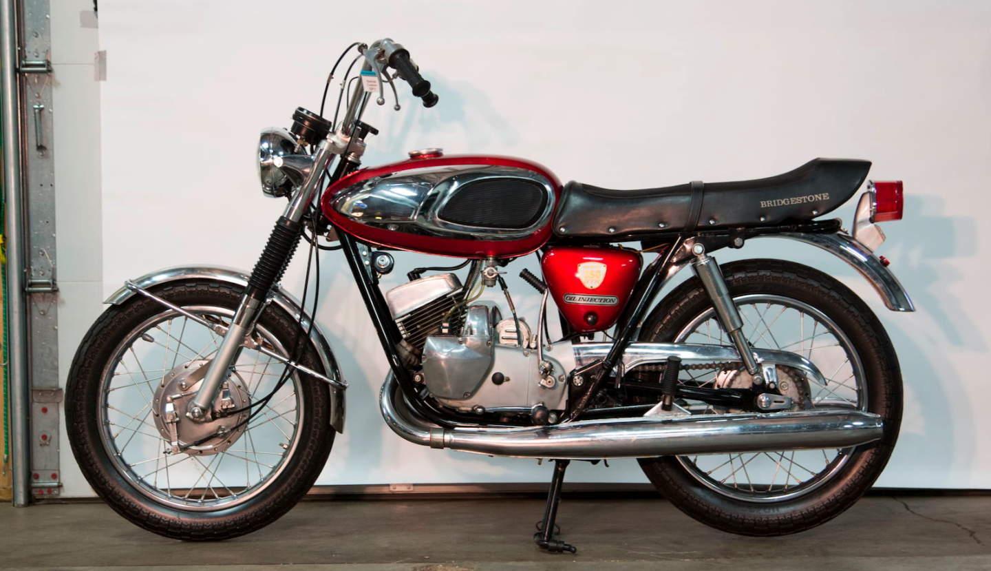 This 1968 Bridgestone 350 GTR was a bargain for someone at just $4,950. Until the early 1970s, globally renowned tire manufacturer Bridgestone also made a range of motorcycles which were of exceptional quality. This was the largest motorcycle produced by Bridgestone, the 350 GTR, and it was produced in very limited quantities - believed to have been just 9,000 units.Around that time, the other major motorcycle manufacturers made Bridgestone an offer it couldn't refuse: stop making motorcycles or we won't use your tires on our motorcycles.Bridgestone complied, and this roadgoing motorcycle, which was faster than the Yamaha 350cc Grand Prix roadster (see below) of the same period, was shelved. It was faster thanks to its use of disc valve induction and this bike was sold with just one previous owner plus full documentation including the original owners manual, and an original parts catalog.