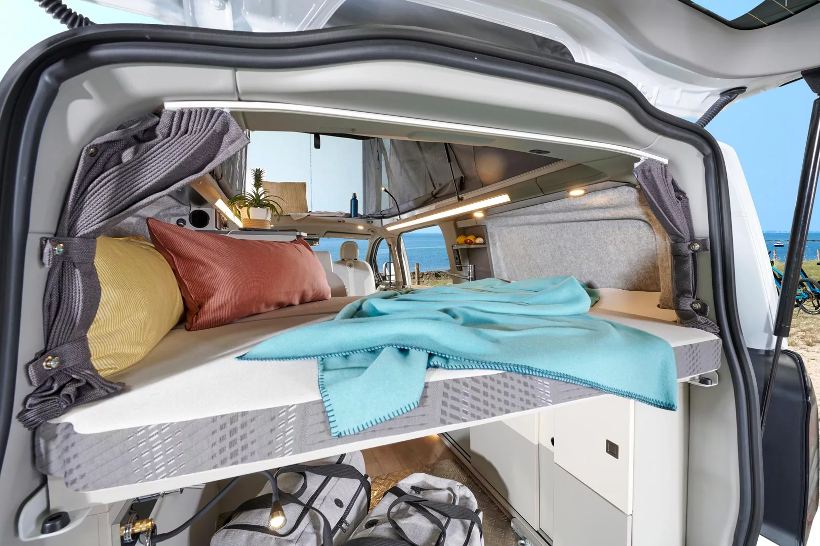 Side flares: Making a human-size transverse bed in a previously subhuman van space