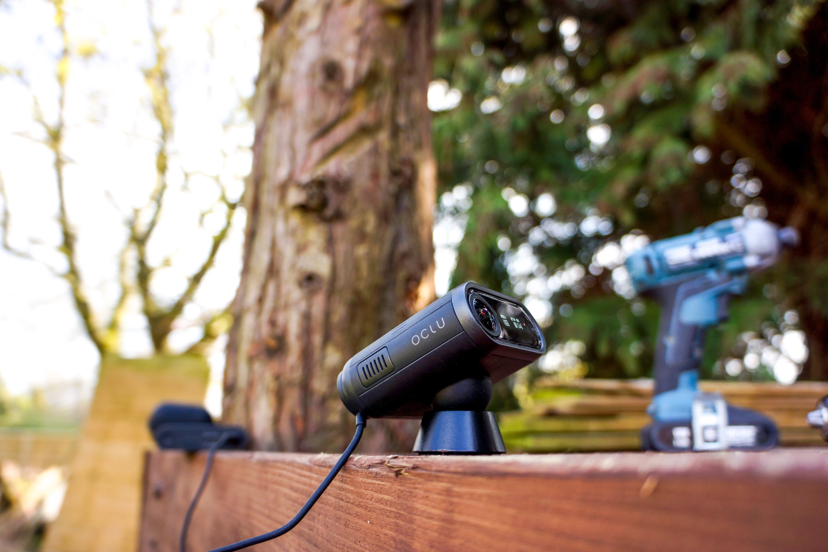 Charges with a magnetic ring that sticks onto the back of the camera