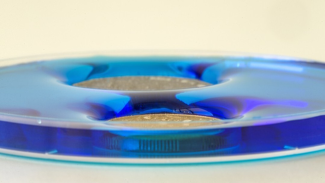 The material, sprayed onto these coins, can repel water for long periods of time without needing to be reapplied