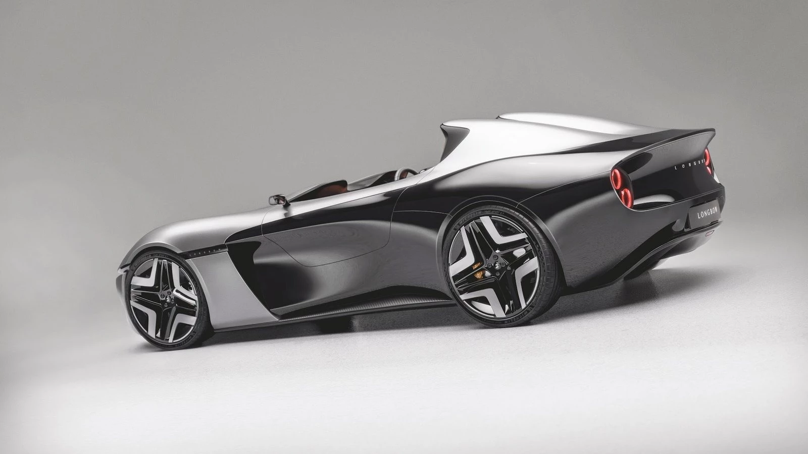 The shared aluminum chassis for the cars is hand-built in the UK