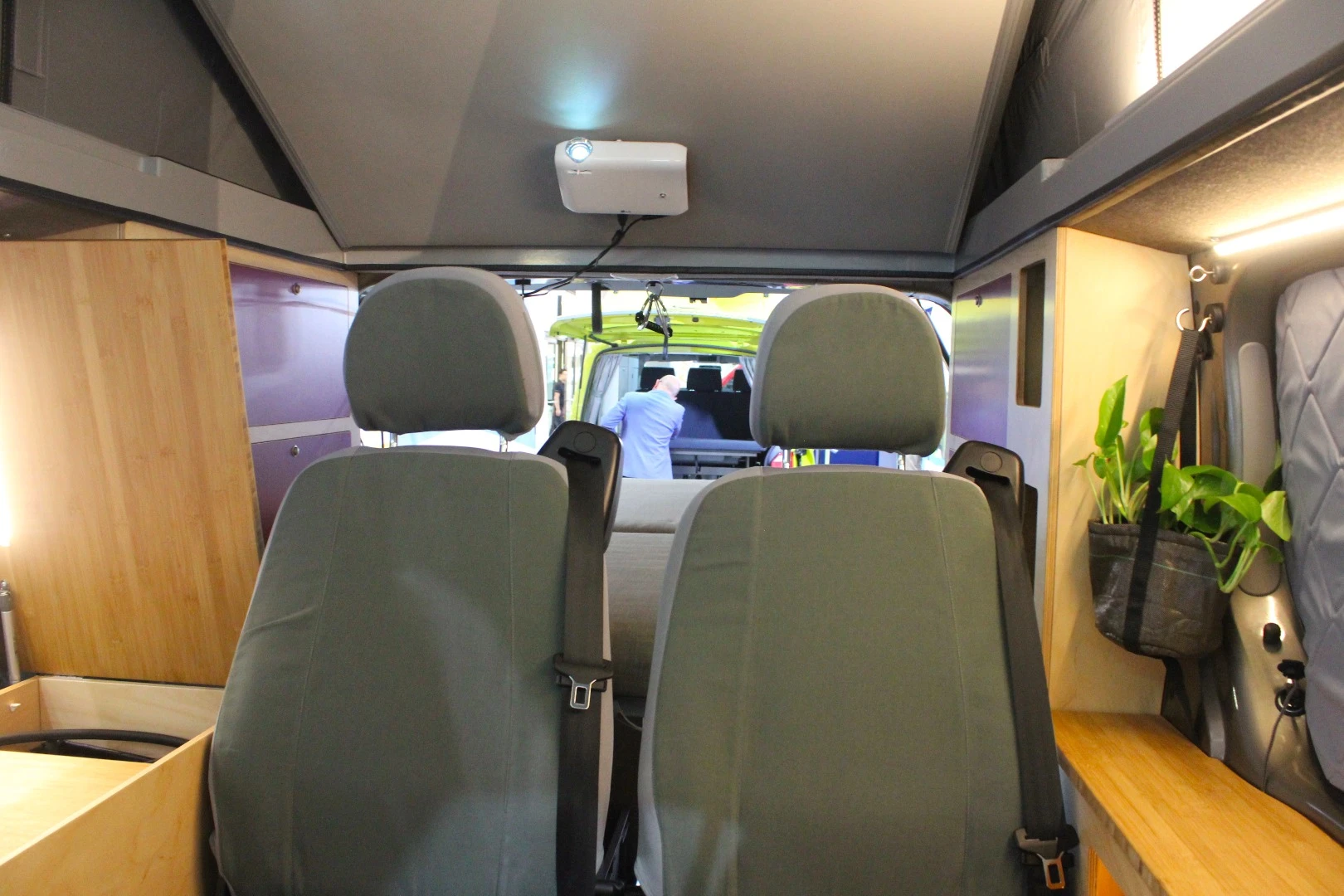 The projector mounts magnetically to the retracted roof bed platform, a neat, simple solution