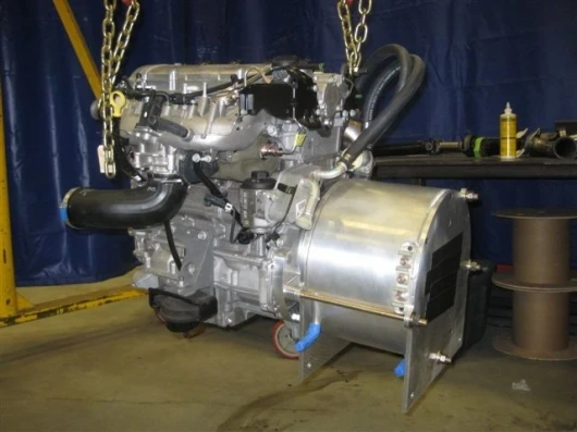 The plug-in technology demonstrator has the original 5.3-liter, 14-miles per gallon, V8 engine removed and replaced with a much smaller 2.2-liter turbocharged, four-cylinder EcoTech engine