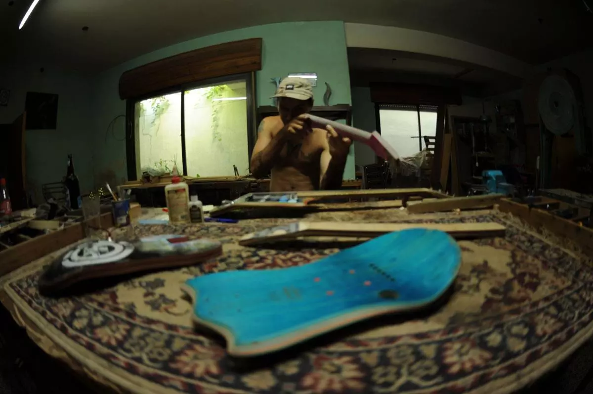 Galasso checks the line of the neck at his workshop in Buenos Aires, Argentina