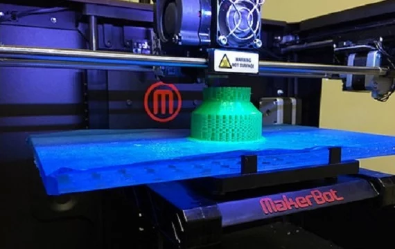 Traditional method for 3D printing a Christmas tree, including wasteful support structures (Photo: Simon Fraser University)