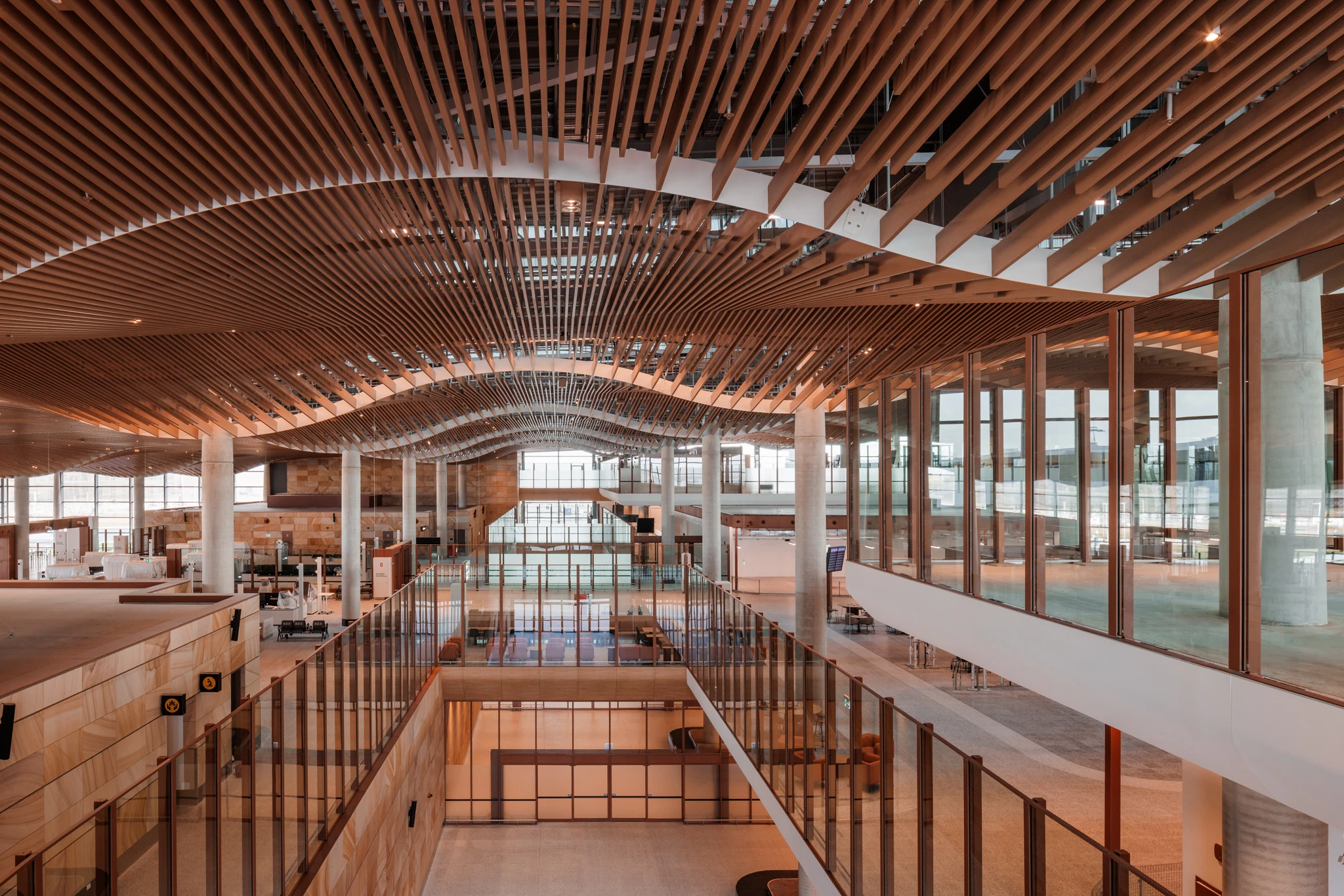 The Western Sydney International Airport's interior is defined by its eye-catching sculpted aluminum ceiling