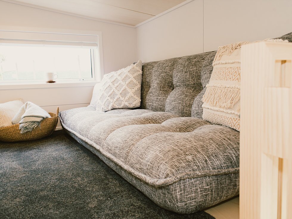 The Archer Tiny House's upstairs living room/guest room
