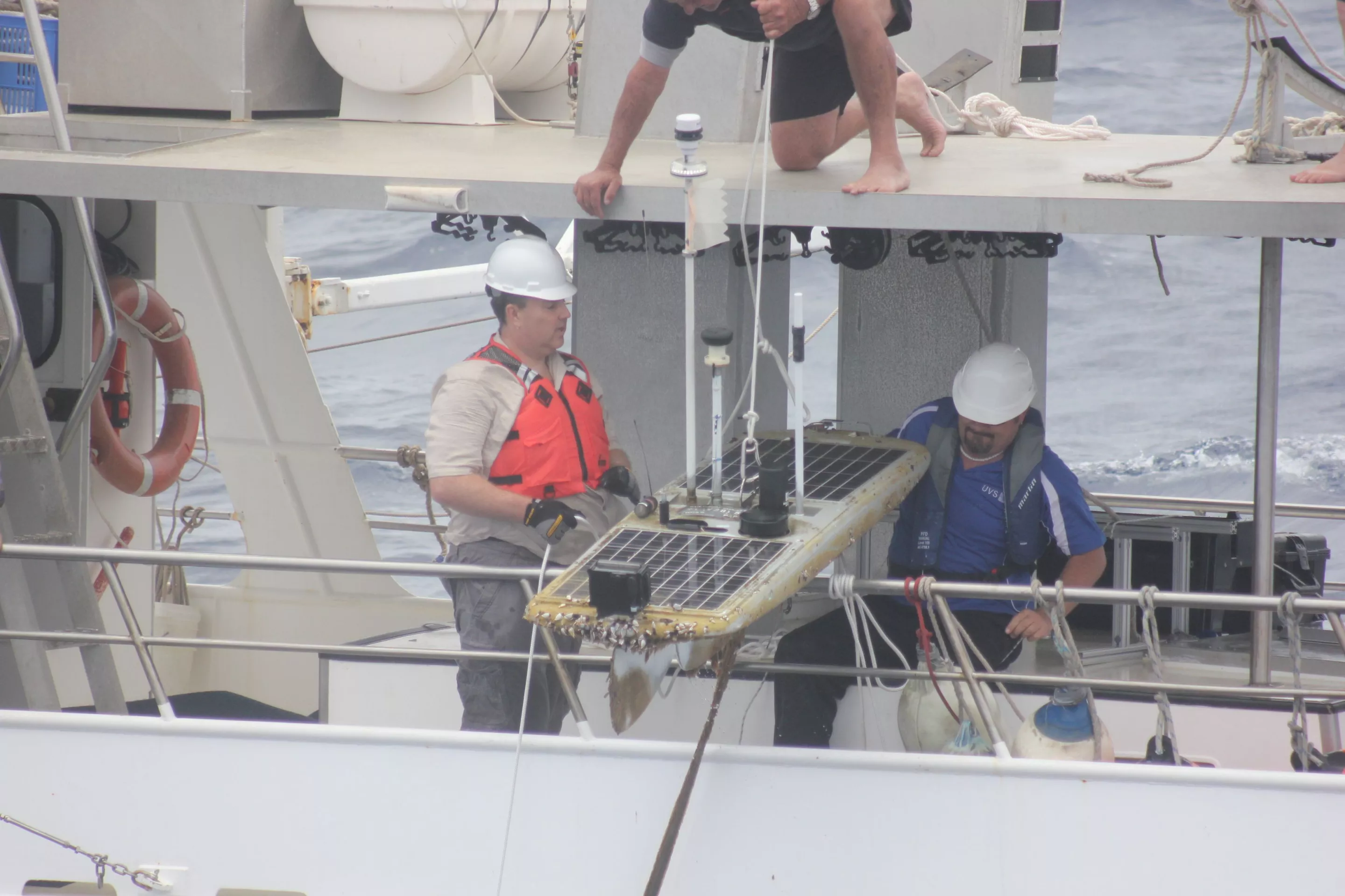 The Papa Mau being hoisted aboard a support vessel