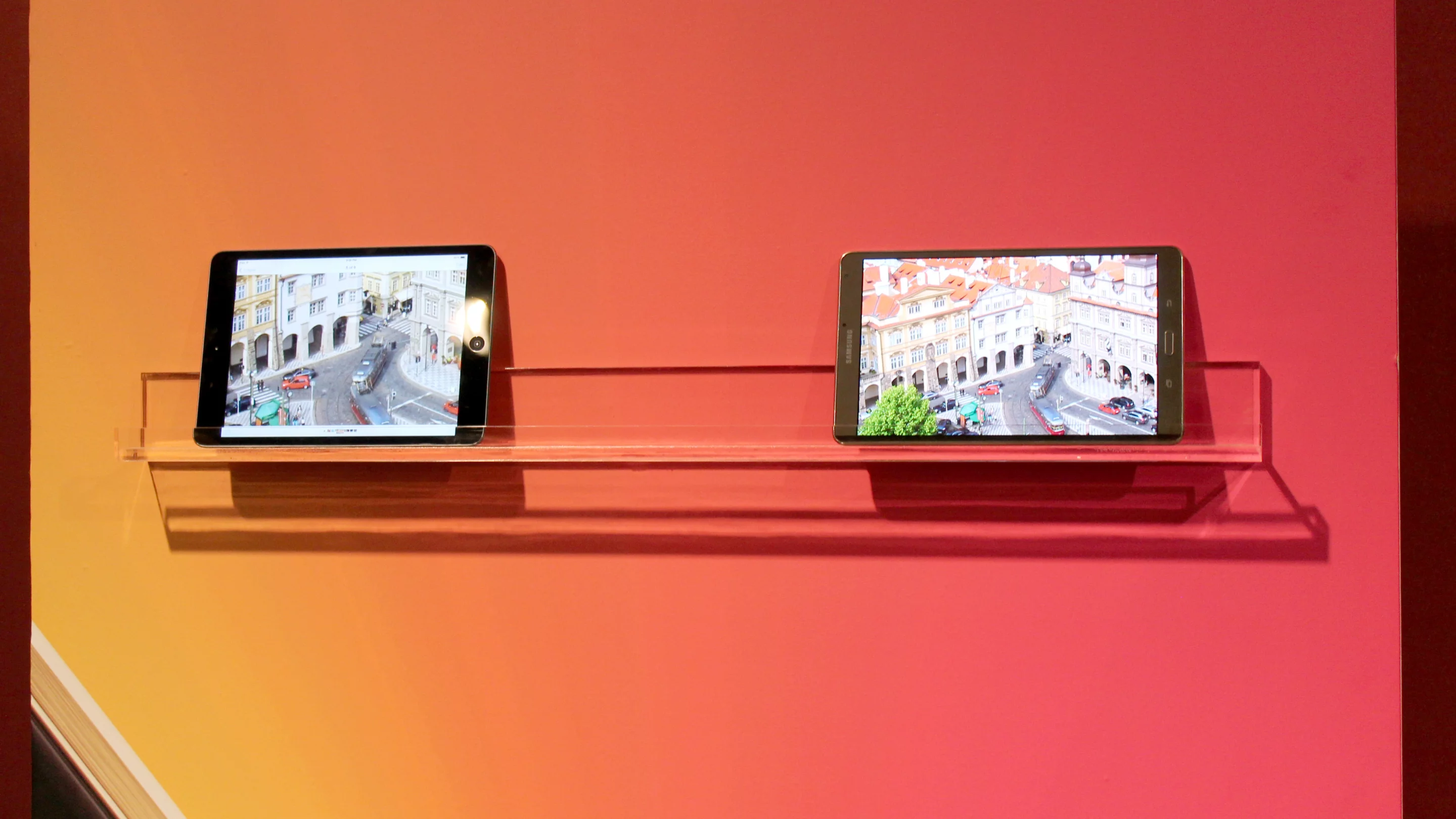 The iPad mini (left) next to the Galaxy Tab S 8.4