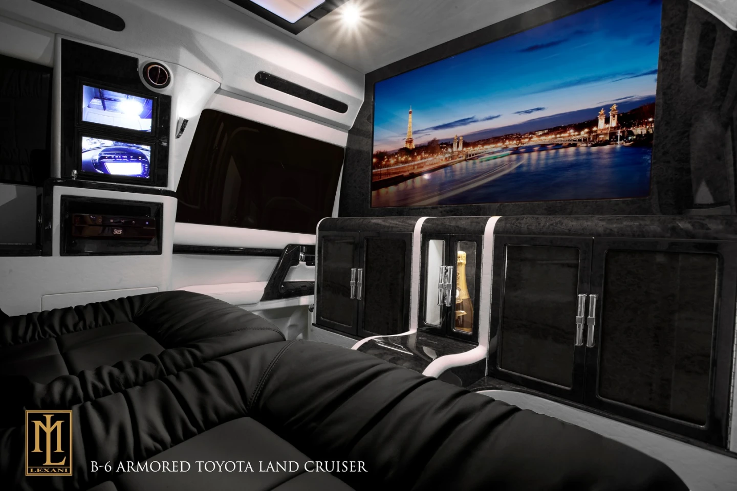 There is a 40-in Samsung LED Smart TV mounted on the fixed privacy partition, with an accompanying Blu-Ray/DVD player