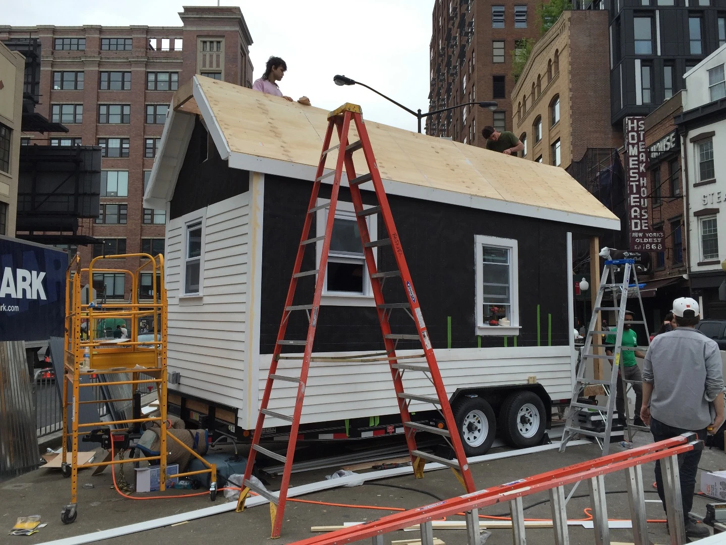 It features cedar siding, white oak veneered flooring, and vinyl windows