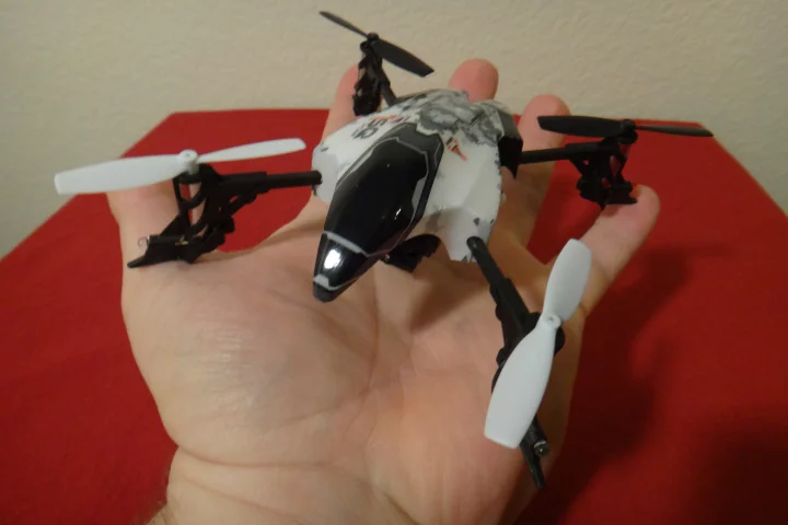 The quadcopter itself fit nicely in the palm of my hand, measuring just 14.5 x 14.3 cm