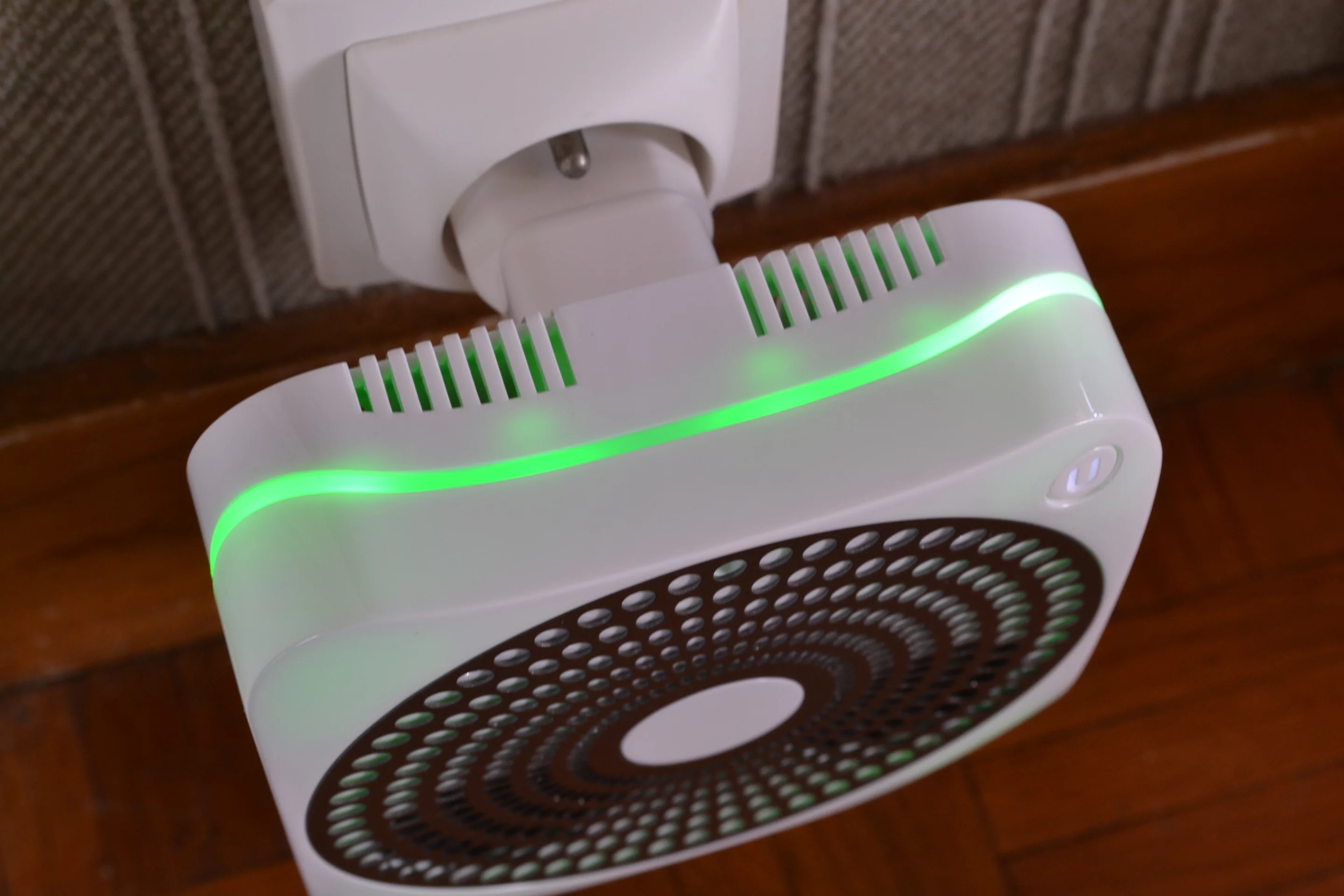 The device is edged by a wavy multi-colored LED light band sandwiched between the front and back of the casing