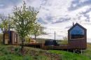 The NestOff is a compact non-towable tiny house that boasts a sauna, hot tub, and cozy interior for two