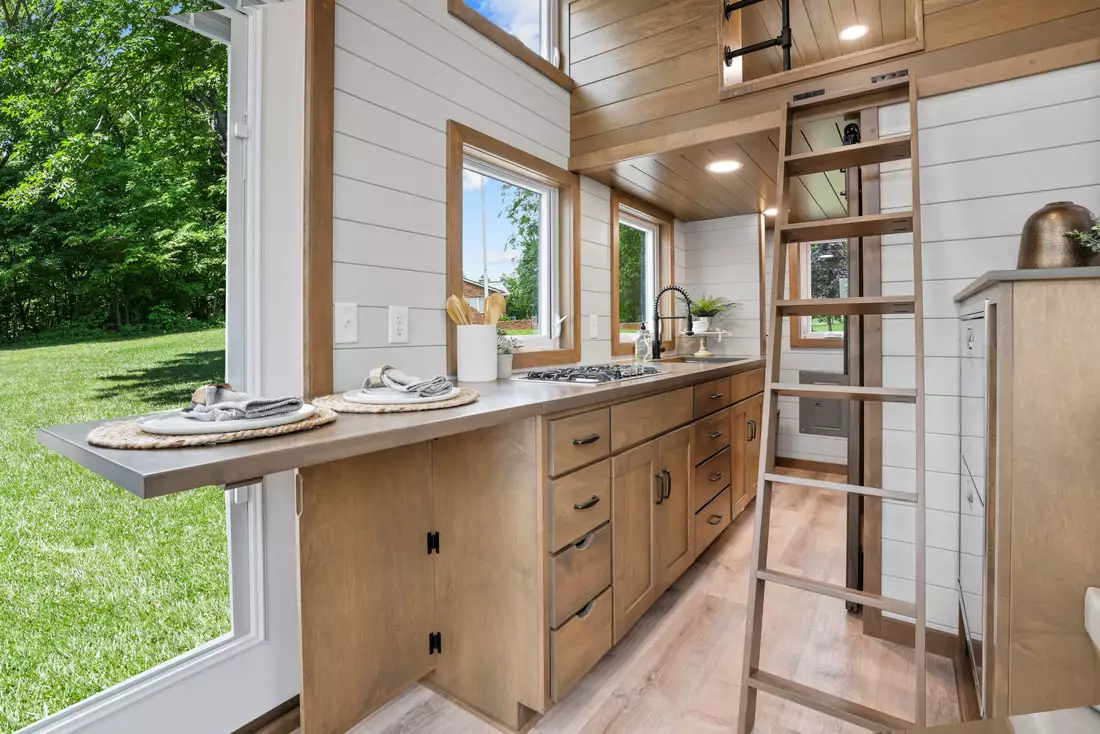 The Pathway's kitchen includes a small drop-down dining area for two