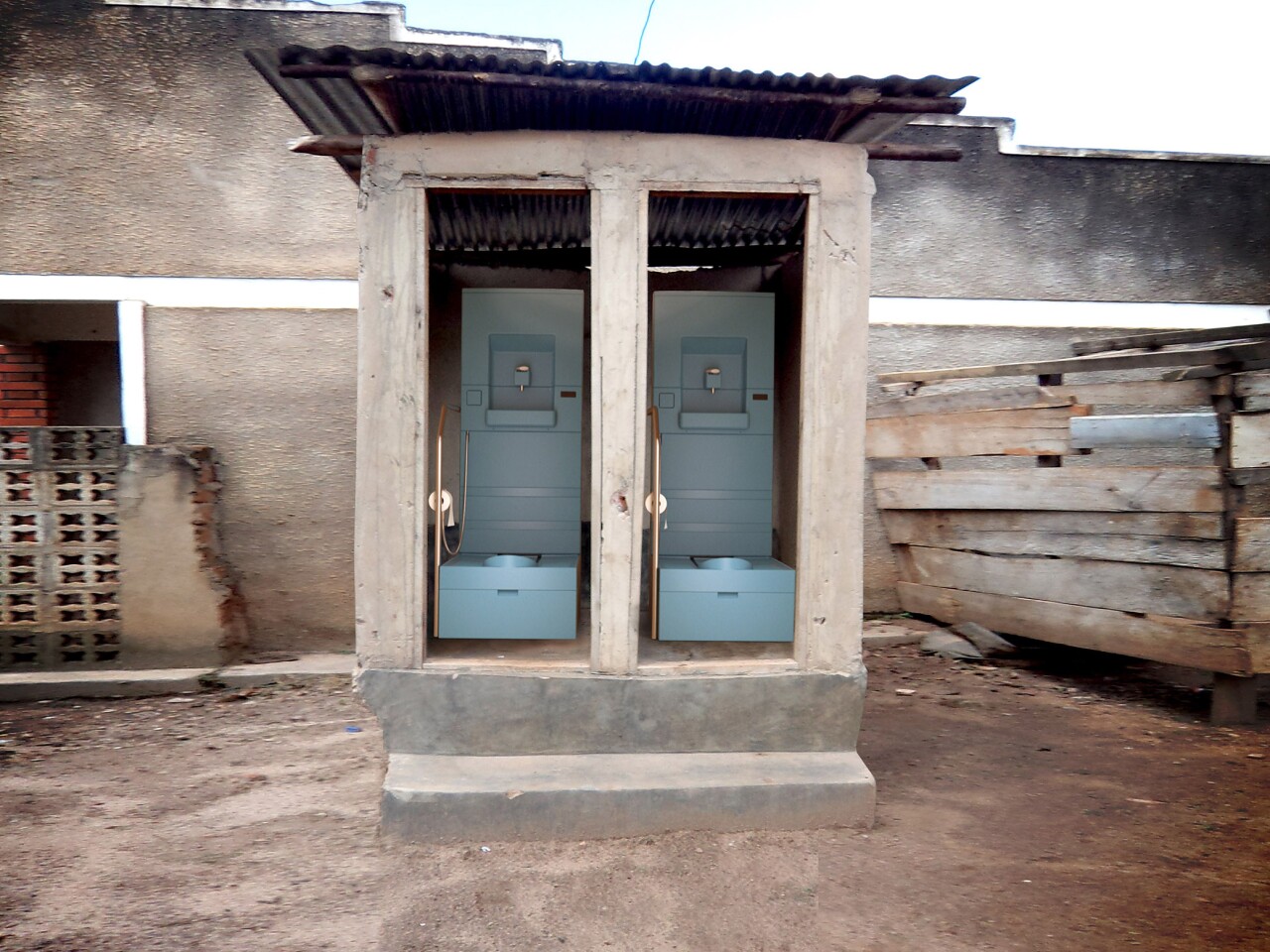 A pit latrine retrofitted with two Blue Diversion toilets