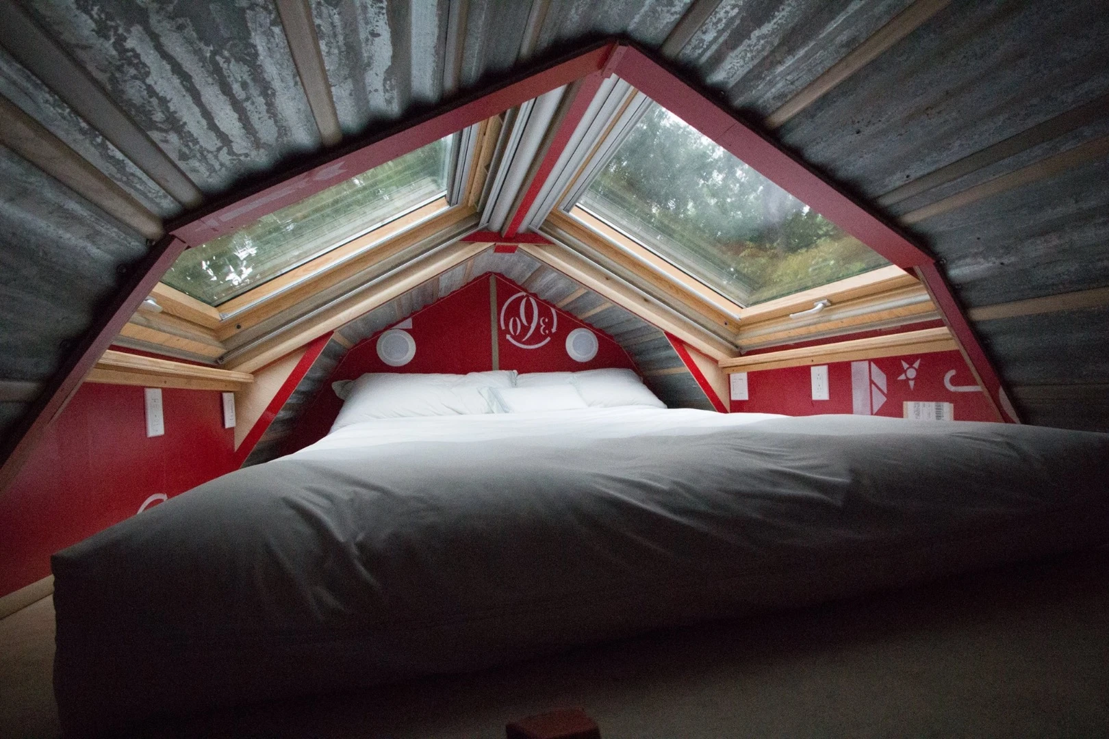 The upstairs sleeping loft looks very snug and that metal roof could drive you to distraction in a rainstorm