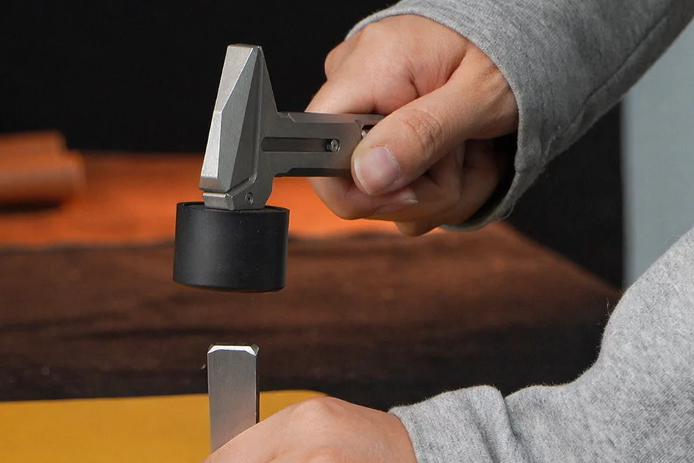 The hammer with one of its silicone mallet caps in place