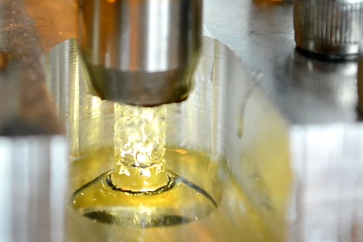 A projection micro-stereo-lithography process like that used to inexpensively produce terahertz frequency lenses