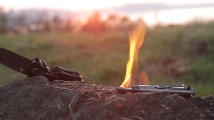 The Endure has everything you need to start a flame: ferro rod, striker and tinder