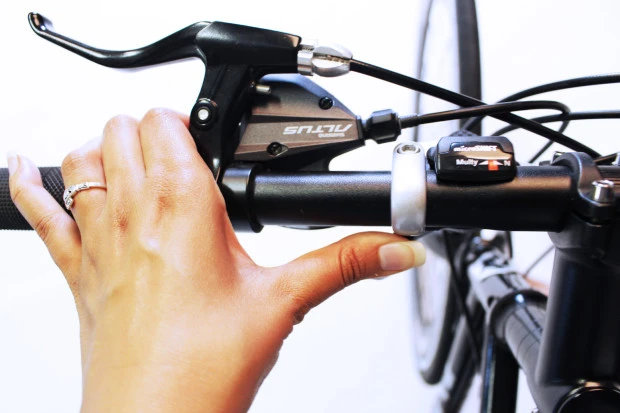 A bar-mounted thumb switch is used to select between the Caron Bicycle's different pedaling modes