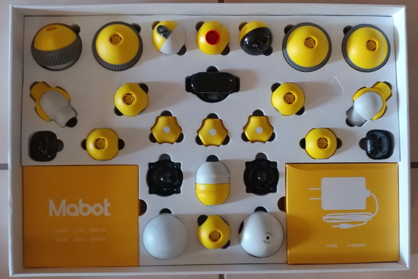 Inside our Mabot kit are a series of components set up in foam backing for security. The box to the bottom-right contains the charging cord and USB plug and the box to the bottom-left the S-rods and other connectors