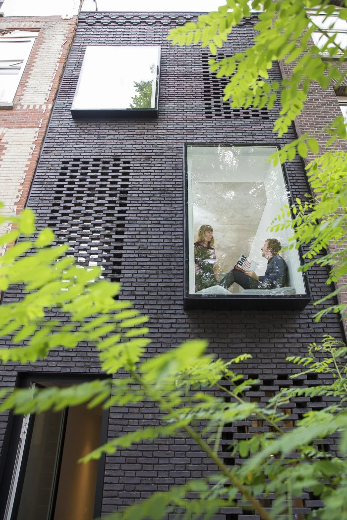 The SkinnyScar's facade features patterned brickwork